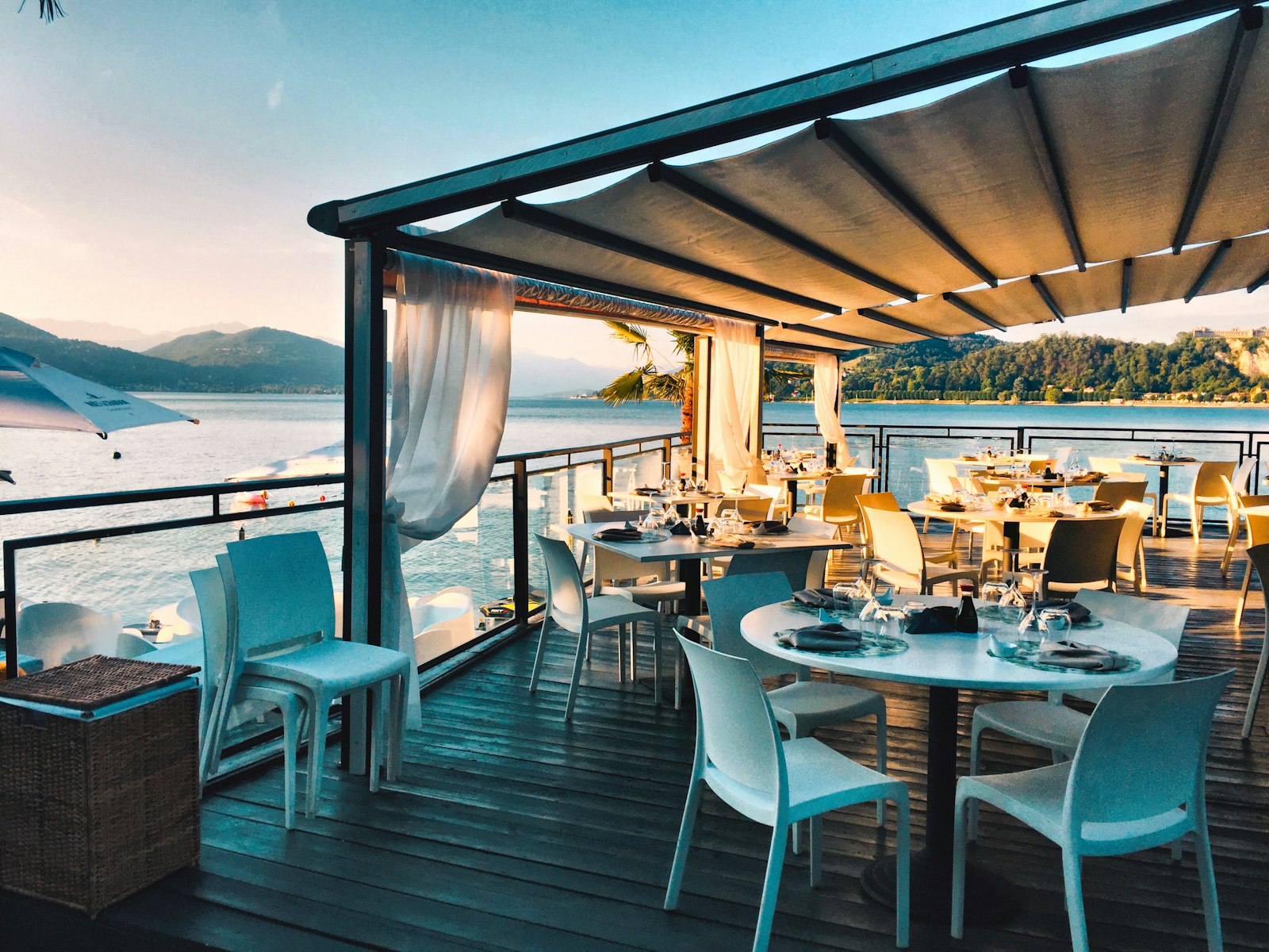 Waterfront restaurant terrace at sunset